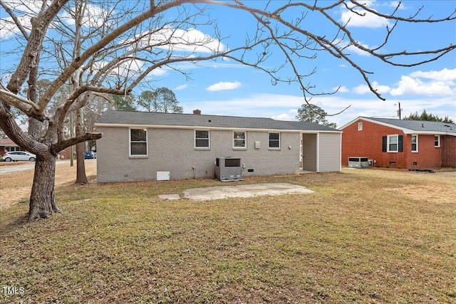 back of house with a patio, central AC unit, and a lawn