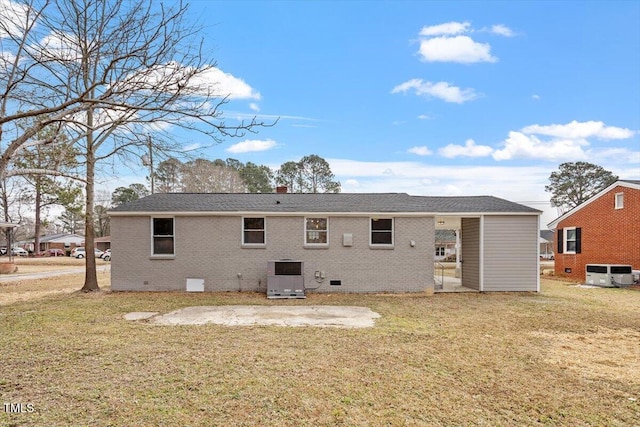 back of property featuring a patio area, central air condition unit, and a lawn