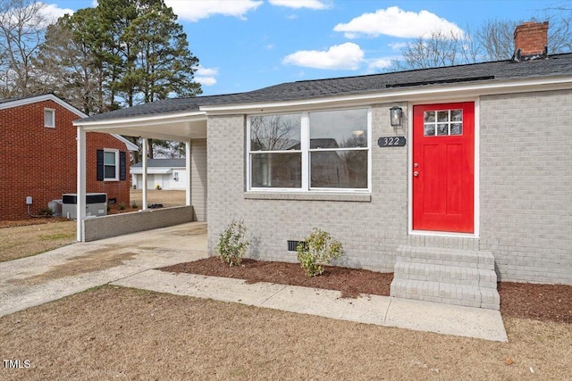 view of exterior entry featuring central AC