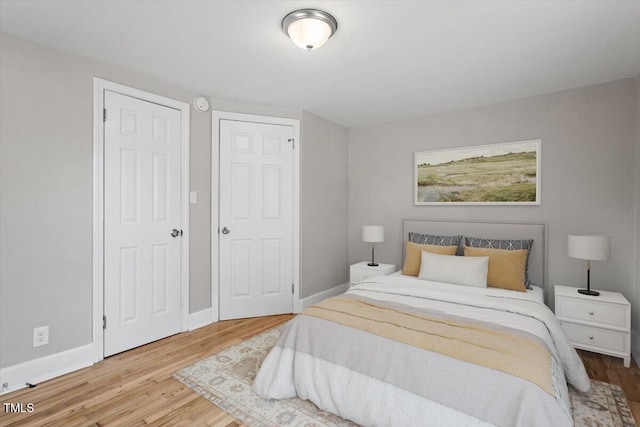 bedroom featuring wood-type flooring