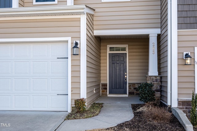 entrance to property featuring a garage