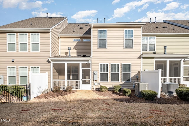 back of property featuring a sunroom and central air condition unit