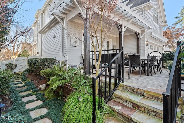 exterior space with a pergola and a deck