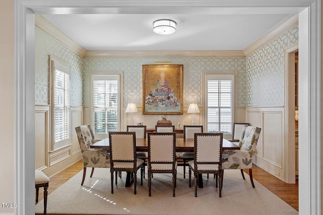 dining room with crown molding and wood-type flooring