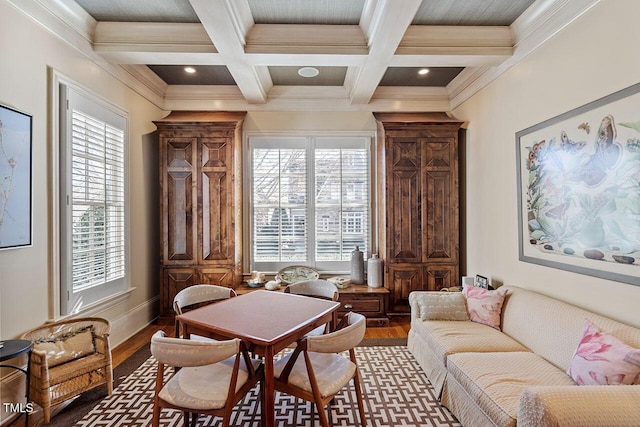 sitting room featuring coffered ceiling, crown molding, wood-type flooring, and beamed ceiling