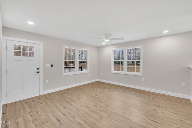 entryway with light hardwood / wood-style floors and ceiling fan