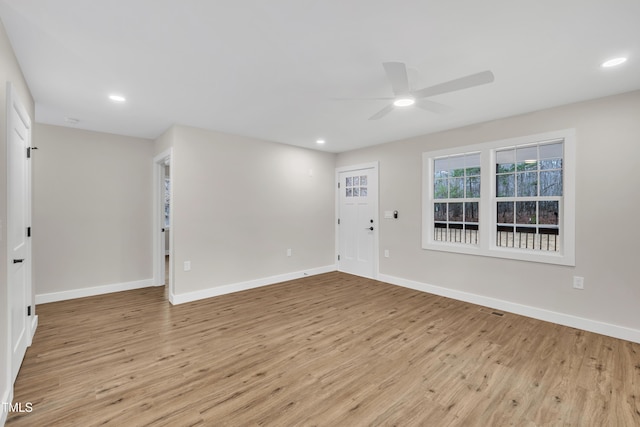 unfurnished room featuring light hardwood / wood-style floors and ceiling fan