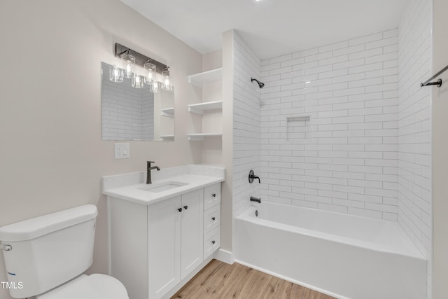 full bathroom featuring vanity, toilet, tiled shower / bath combo, and hardwood / wood-style floors