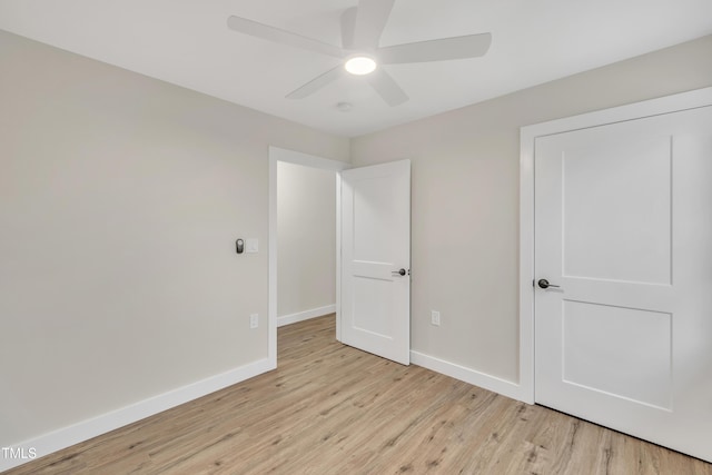 unfurnished bedroom featuring ceiling fan and light hardwood / wood-style flooring