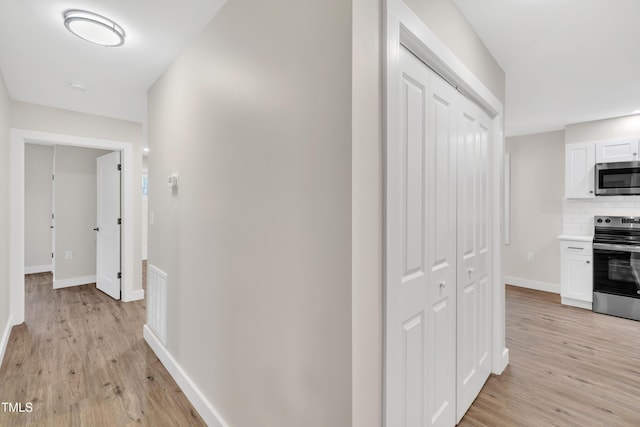 hallway featuring light wood-type flooring