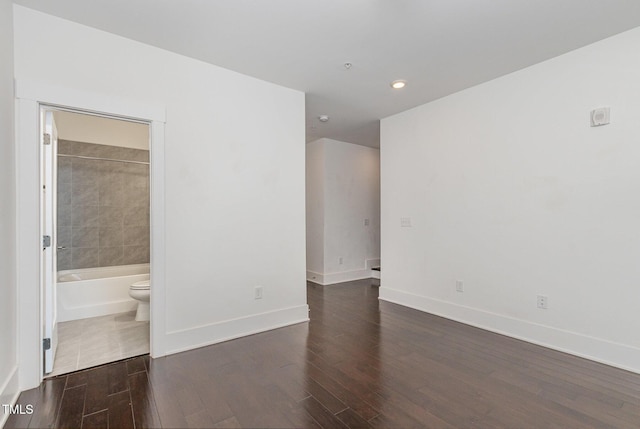 empty room featuring dark hardwood / wood-style floors