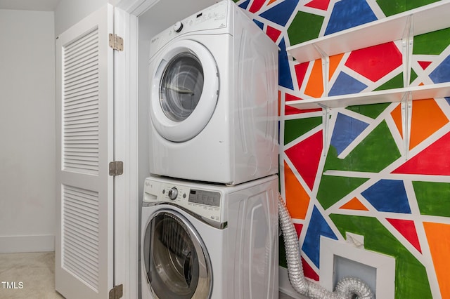 washroom with stacked washer and clothes dryer