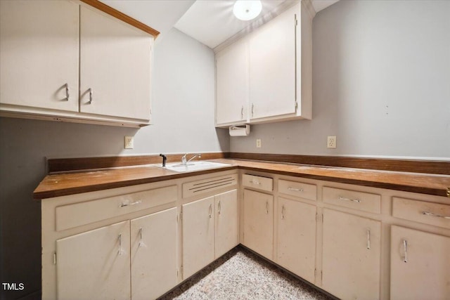 kitchen with butcher block counters and sink