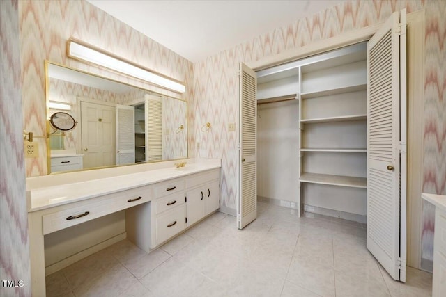 bathroom with vanity and tile patterned flooring