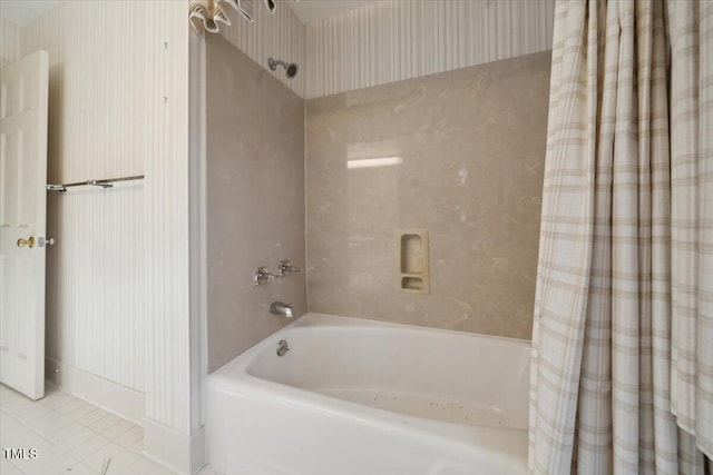 bathroom with shower / bath combination with curtain