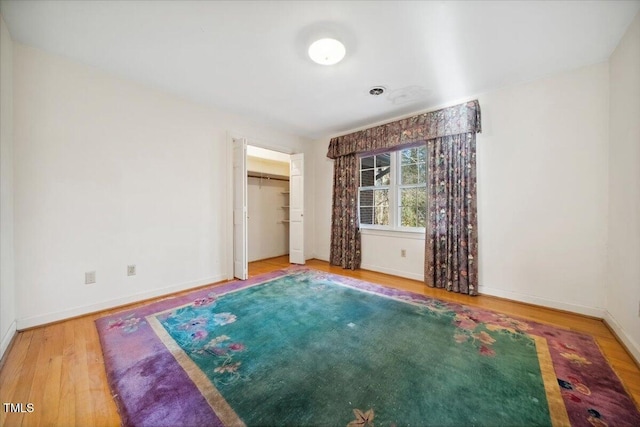 unfurnished bedroom featuring hardwood / wood-style flooring