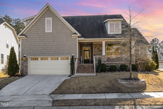 view of front of house featuring a garage and covered porch