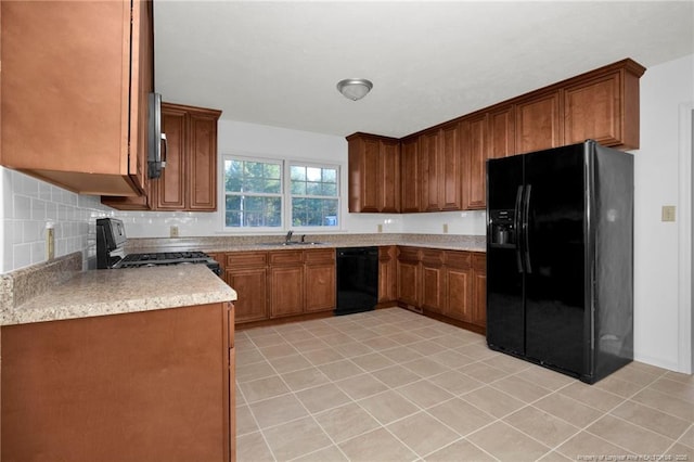 kitchen with sink, backsplash, black appliances, and light tile patterned flooring