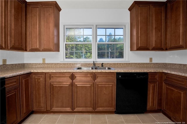 kitchen featuring sink, black dishwasher, and light tile patterned flooring