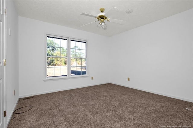 unfurnished room featuring ceiling fan and carpet floors