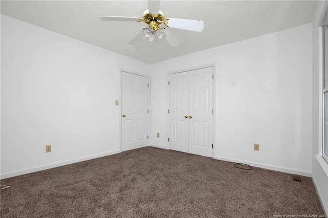 unfurnished bedroom with carpet floors and ceiling fan