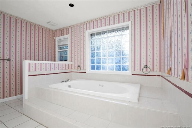 bathroom with tile patterned flooring and a relaxing tiled tub