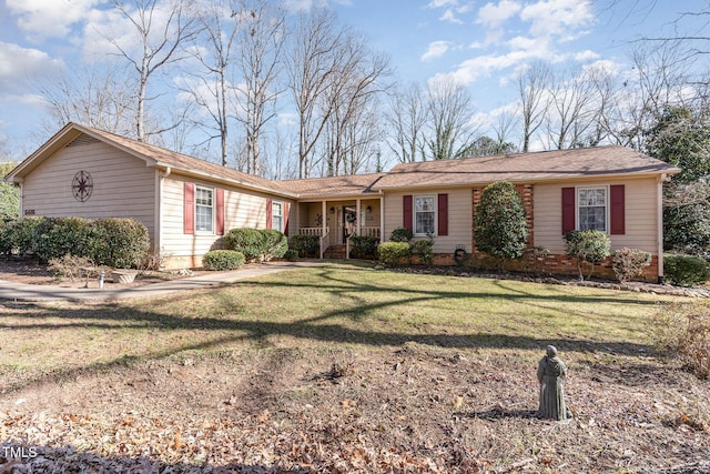 single story home with a front yard and covered porch