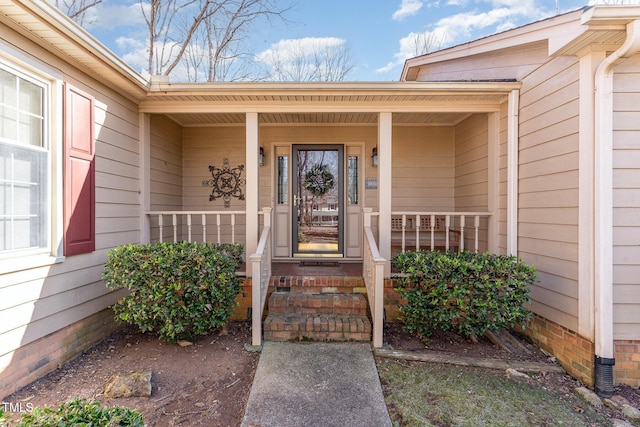 entrance to property with covered porch