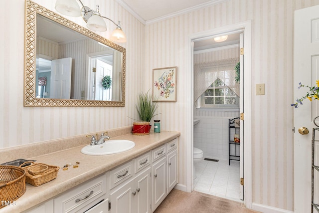 bathroom featuring tile patterned flooring, crown molding, vanity, and toilet