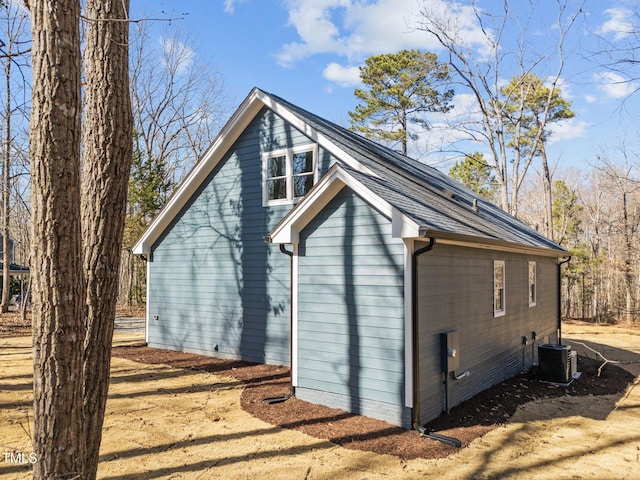 view of side of home featuring central AC unit