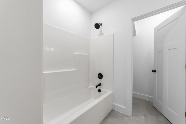 bathroom featuring tile patterned floors and tub / shower combination