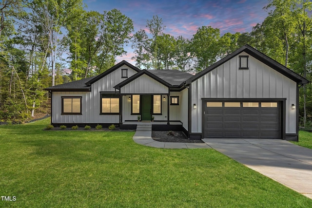 251 Sequoia Dr, Louisburg, NC 27549 - modern farmhouse style home featuring a garage, driveway, a front lawn, board and batten siding, and covered porch