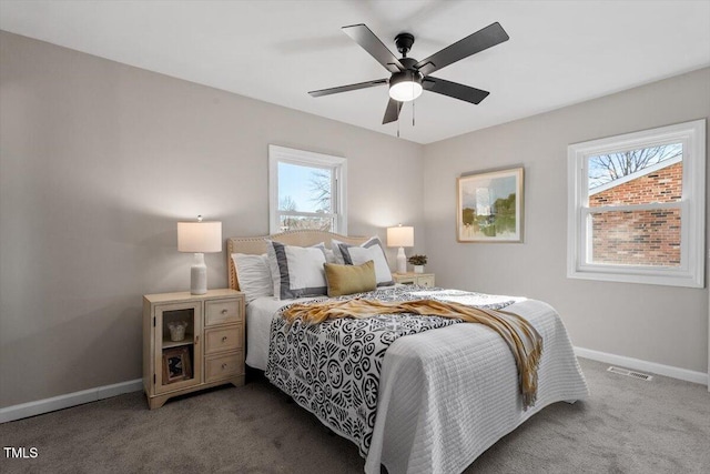 bedroom with carpet flooring, ceiling fan, visible vents, and baseboards