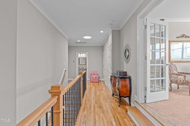 hallway featuring ornamental molding and wood-type flooring