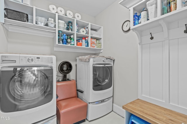 washroom with light tile patterned flooring and washer / dryer