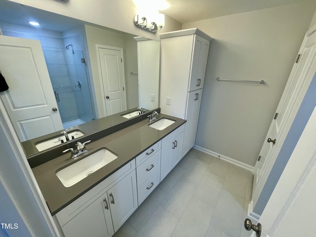 bathroom featuring vanity and an enclosed shower