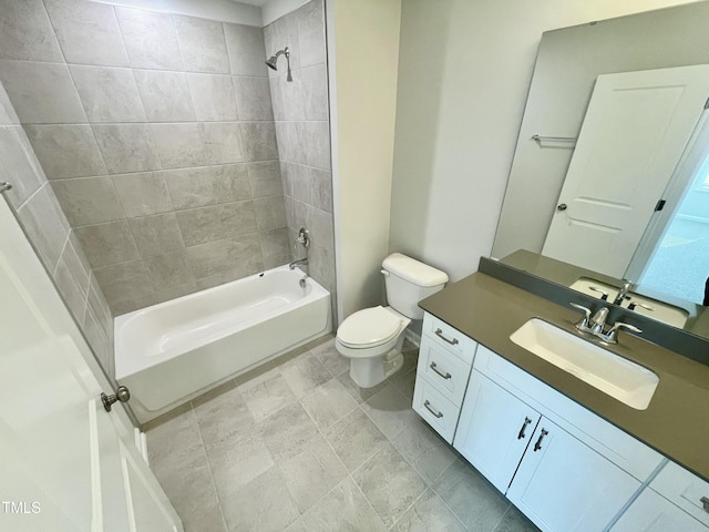 full bathroom with vanity, toilet, and tiled shower / bath