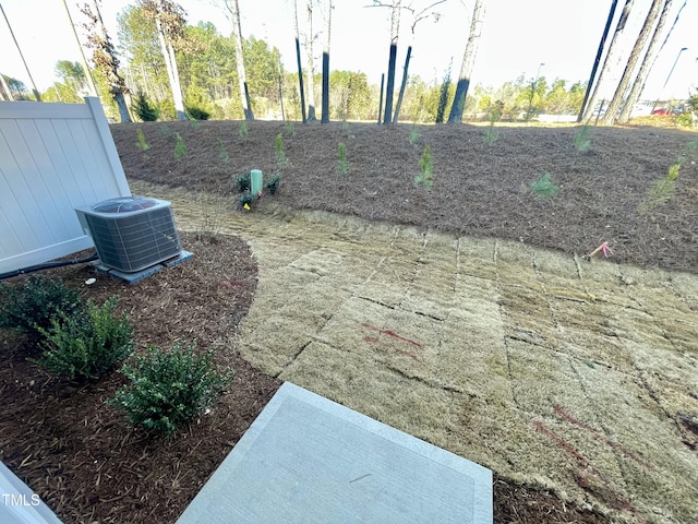 view of yard with central air condition unit