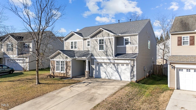 view of front property with a garage and a front yard