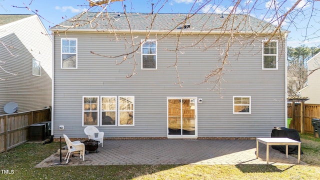 back of property featuring central air condition unit and a patio area