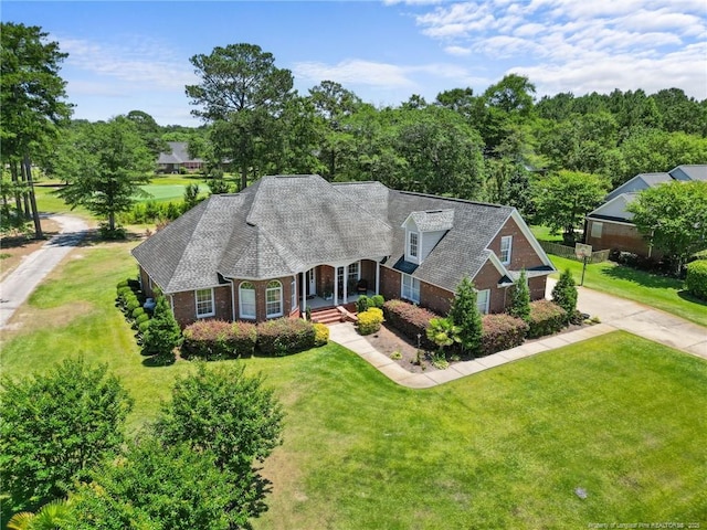 cape cod house featuring a front lawn