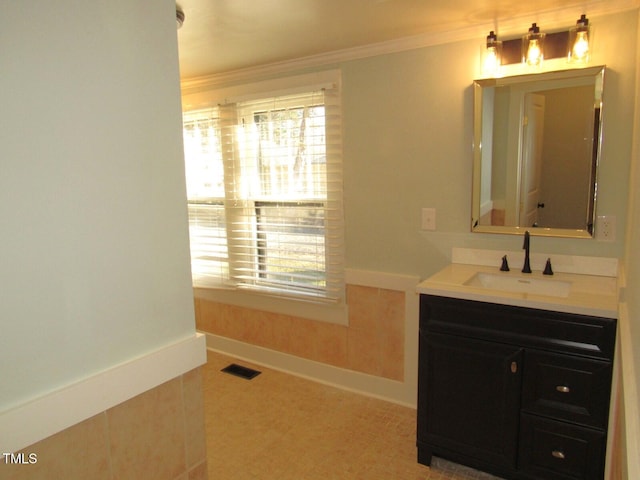 bathroom with vanity and crown molding