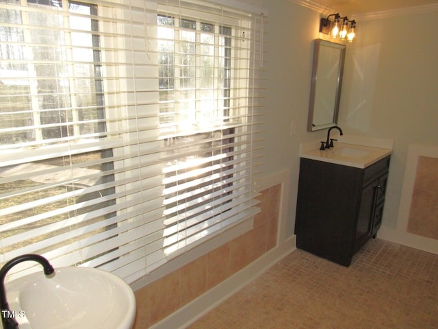 bathroom with vanity, plenty of natural light, and crown molding