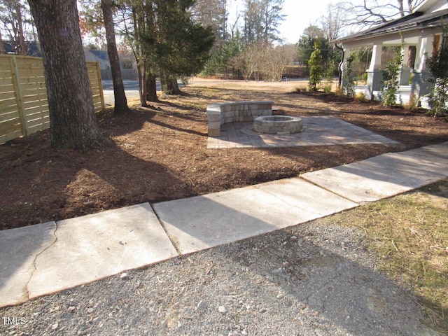 view of yard with a fire pit