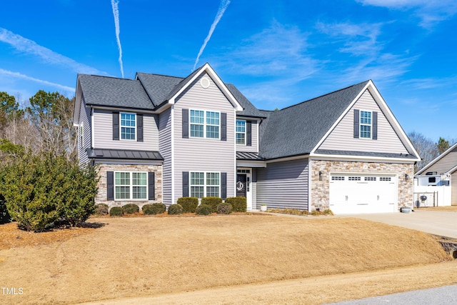 view of front facade with a garage and a front lawn