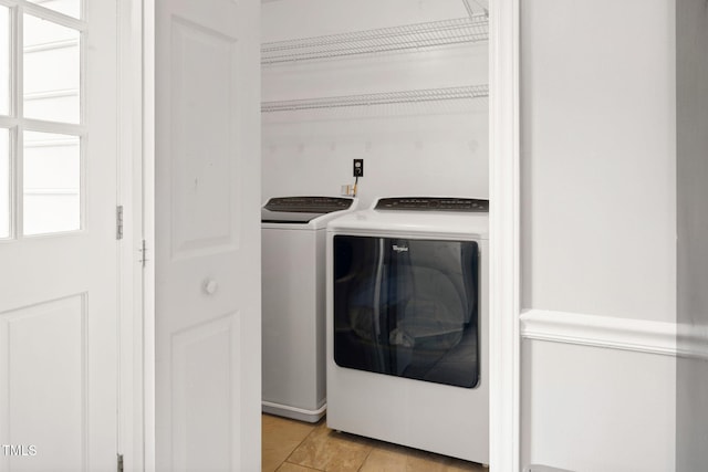 clothes washing area featuring washer and dryer