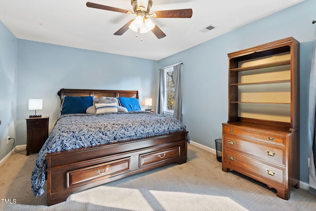 bedroom with light carpet and ceiling fan