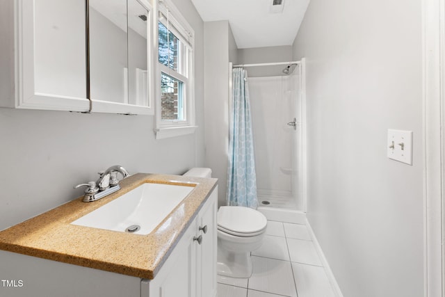 bathroom with vanity, tile patterned flooring, curtained shower, and toilet