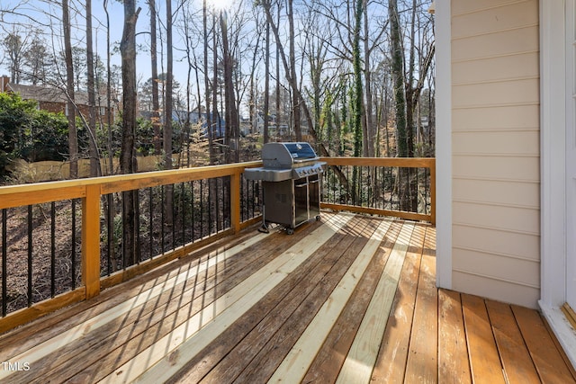 wooden terrace with area for grilling