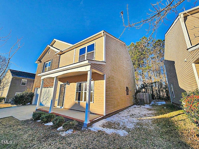 view of front of house featuring a garage and covered porch